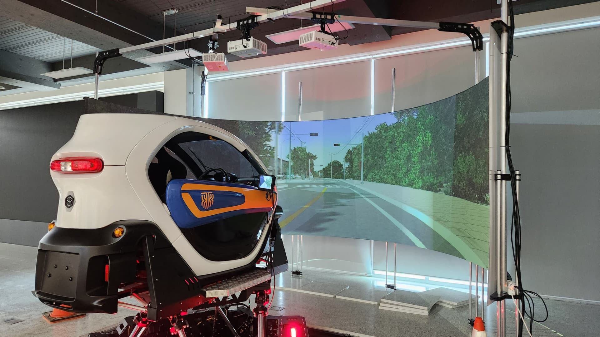 6DOF full-cabin driving simulator on a Motion Systems platform in a research lab